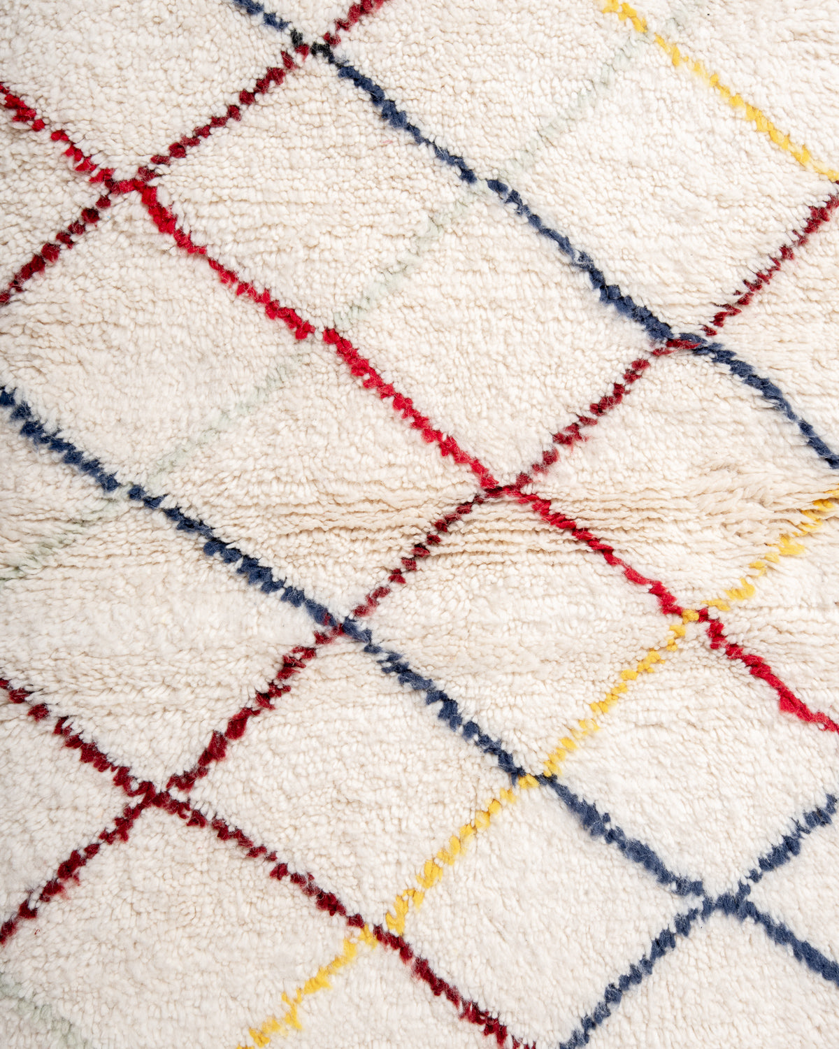 Modern, designer, handcrafted Berber rug from Morocco. Beniourain carpet with beautiful colours and patterns and fluffy wool texture.
